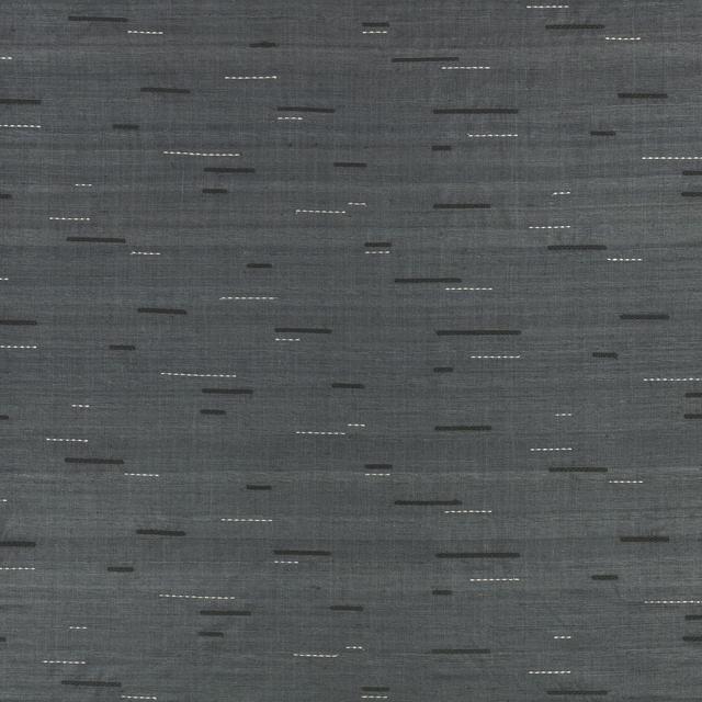 Smoky indigo-grey woven fabric with scattered dark and pale horizontal stitched dashes