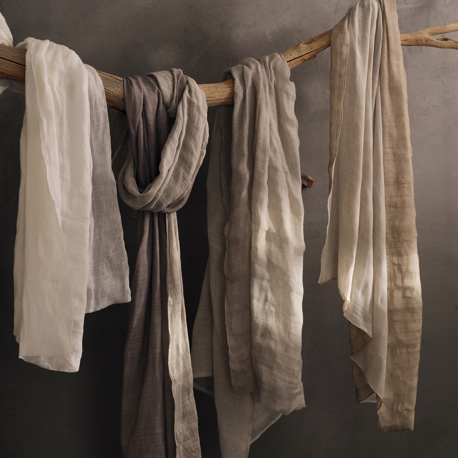 Warm ivory-white sheer with crinkled linen texture hanging in soft vertical folds