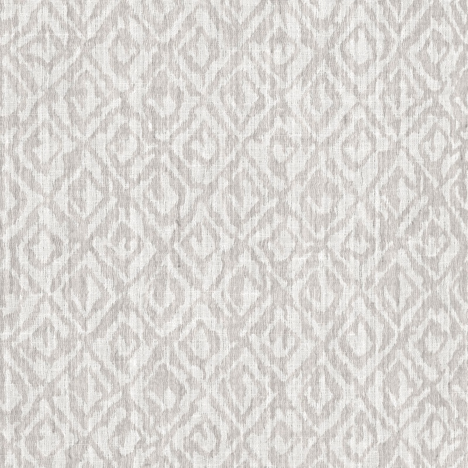 Pale grey mist fabric with blurred ivory ikat motifs and fine texture