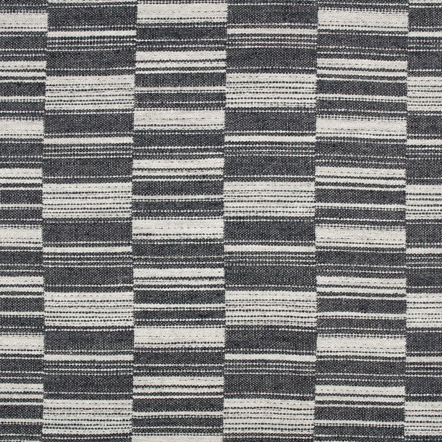 Deep indigo and ivory woven textile with staggered horizontal block stripes