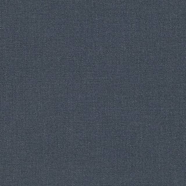 Close-up of deep indigo blue-grey fabric with a fine, subtly textured plain weave