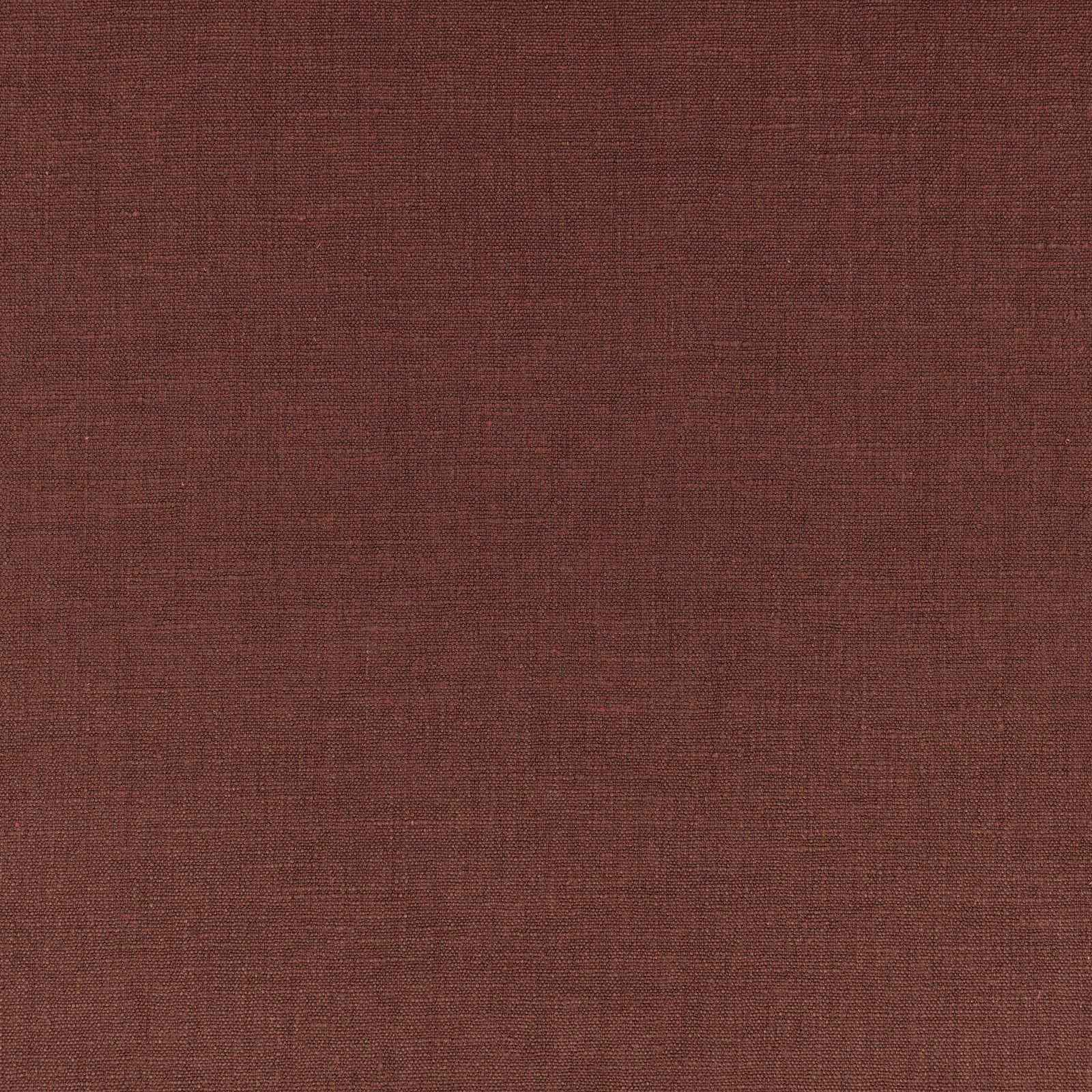 Close-up of warm sienna brown plain weave with subtle crosshatch texture