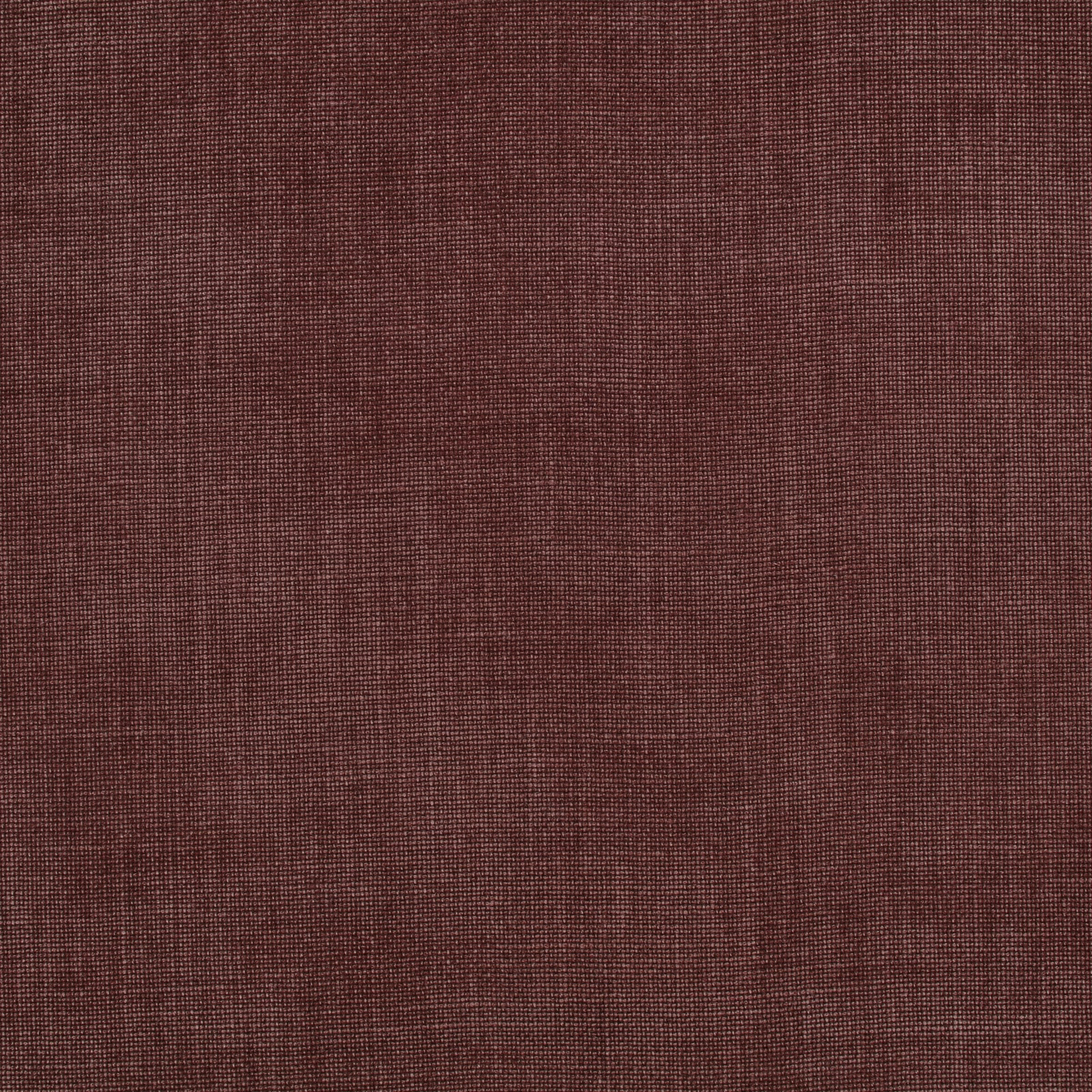 Close-up of muted sienna-brown fabric with a fine crosshatched woven texture