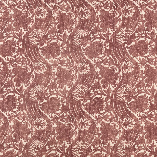 Warm sienna floral repeat on a cream, softly textured textile ground