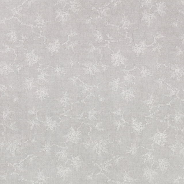 Pale silver-grey woven fabric with delicate white botanical branches and sprigs