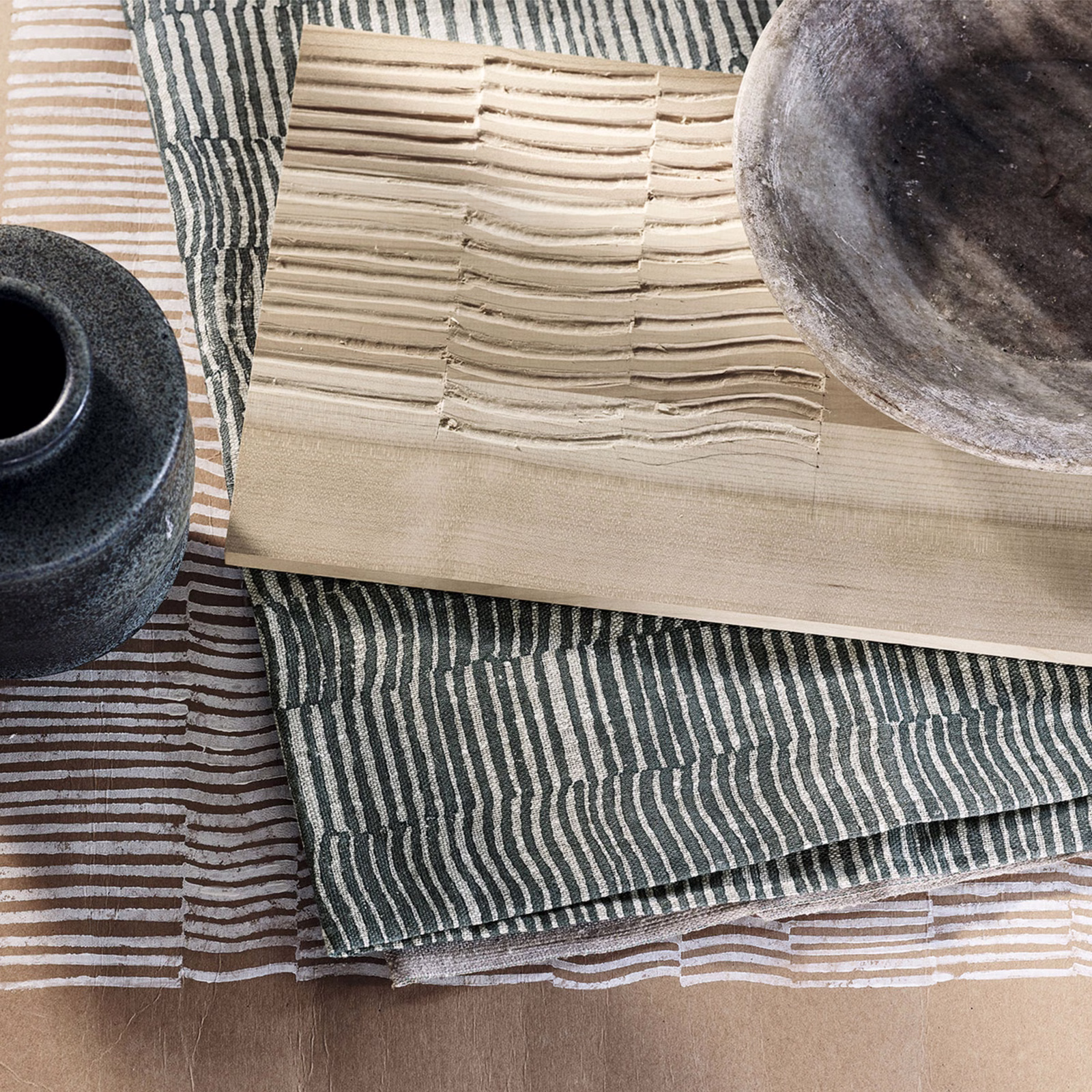 Deep Atlantic blue-green textile with irregular chalk-coloured vertical stripes and tactile woven texture