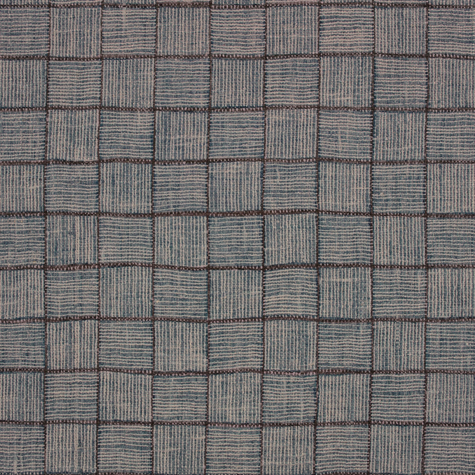 Muted Atlantic blue-grey woven check with ribbed blocks and dark grid lines