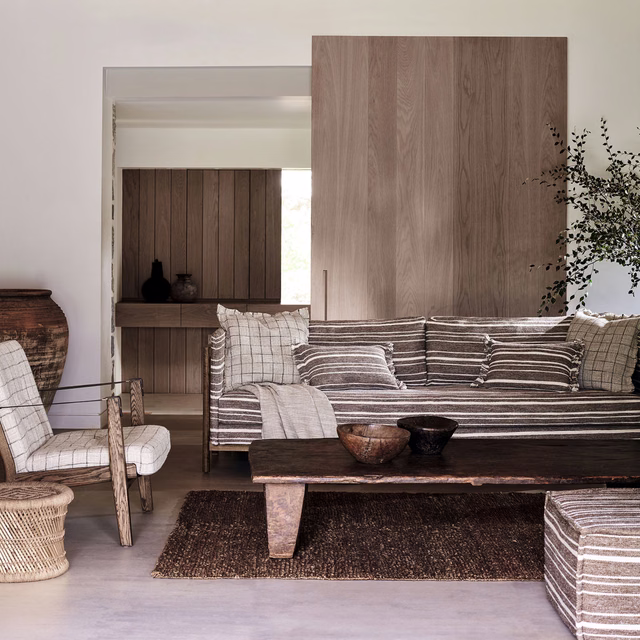 Warm taupe-brown crosshatch upholstery with pale and dark horizontal lines on a sofa