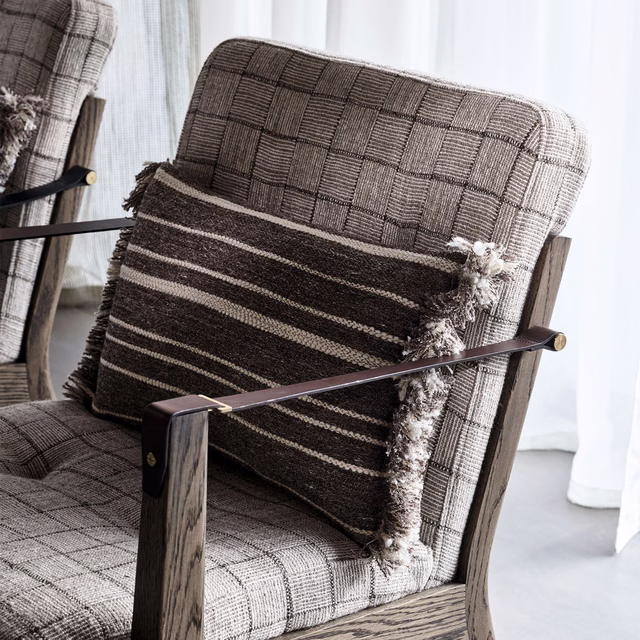 Cool gunmetal windowpane weave with charcoal and ash threads on an upholstered chair