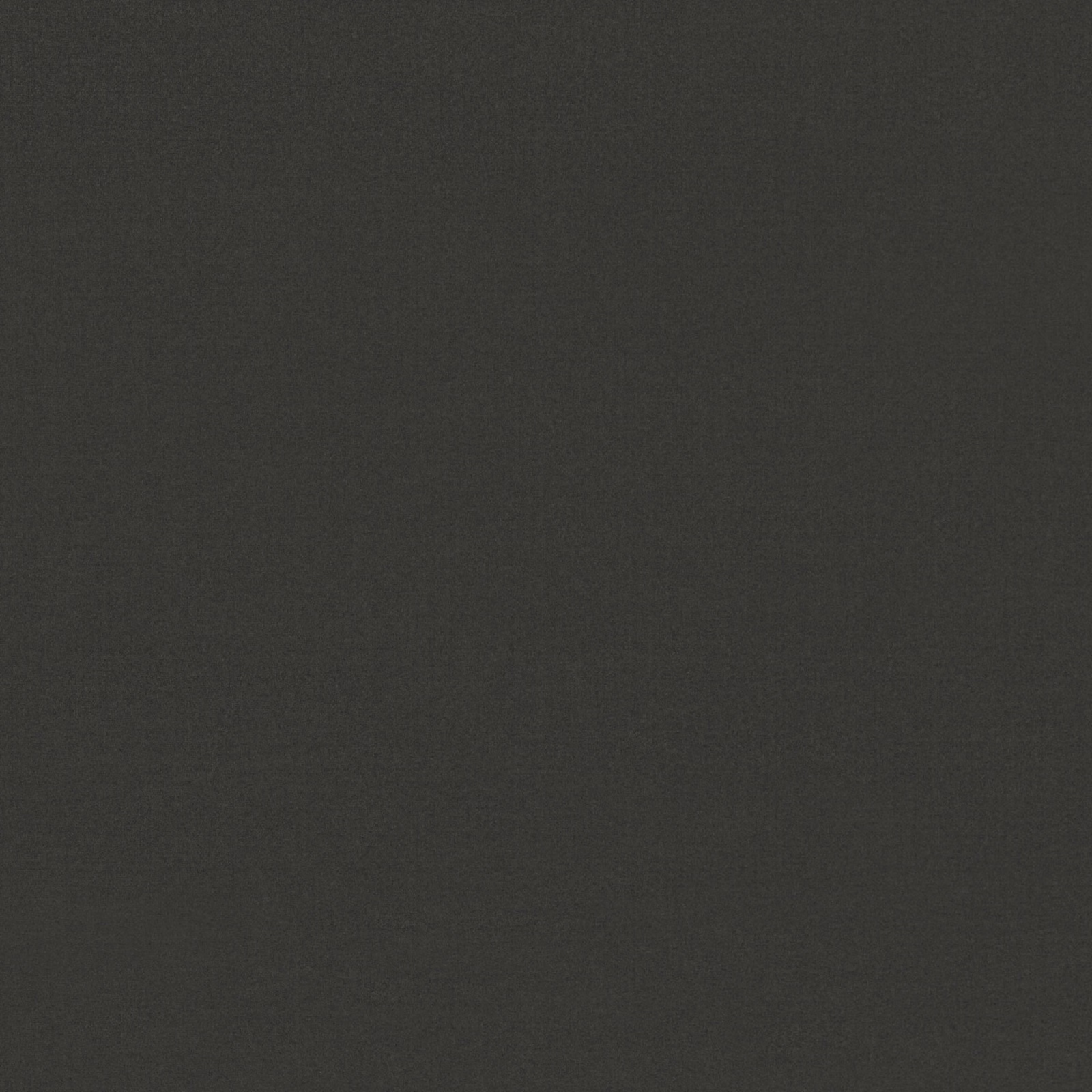 Close-up of deep charcoal-grey velvet with a subtle, light-catching pile