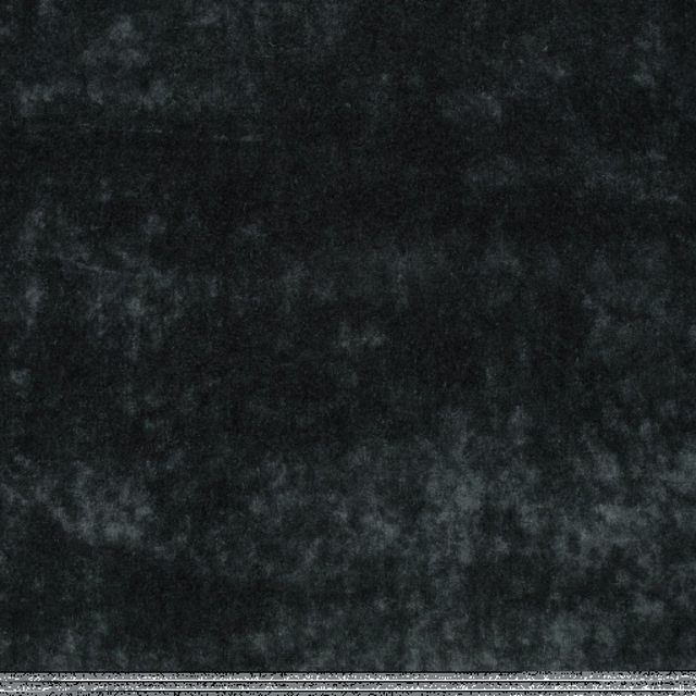 Mottled charcoal-mole velvet with smoky grey highlights across its plush surface