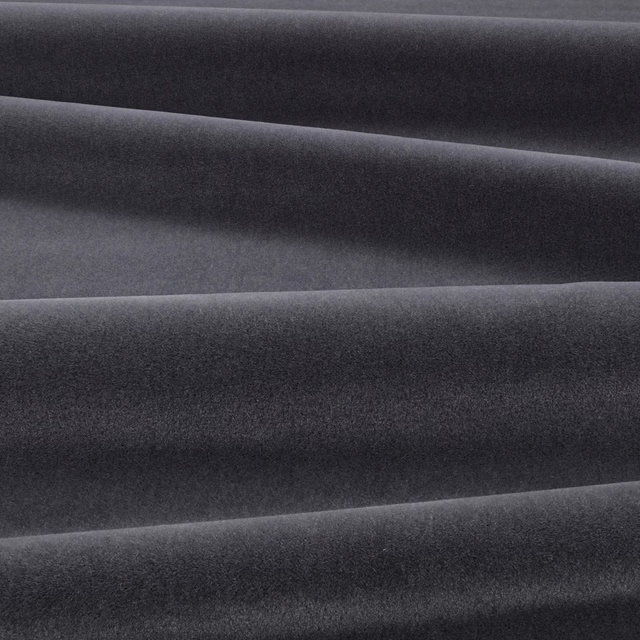 Deep graphite-grey velvet folded into broad ridges, showing a soft directional nap