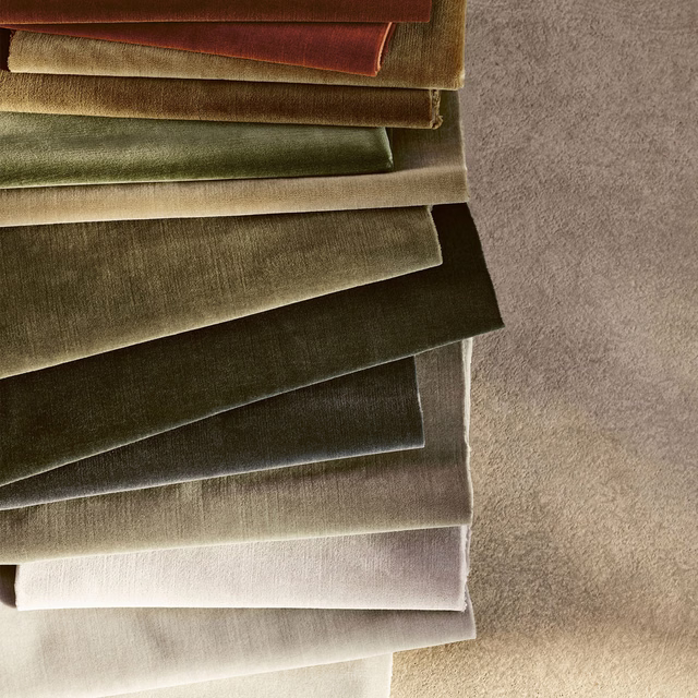 Burnt orange velvet swatch showing smooth pile and coppery light-catching sheen
