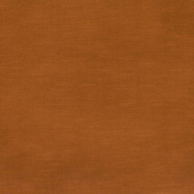 Burnished rust-orange velvet swatch showing subtle directional pile and tonal surface shading