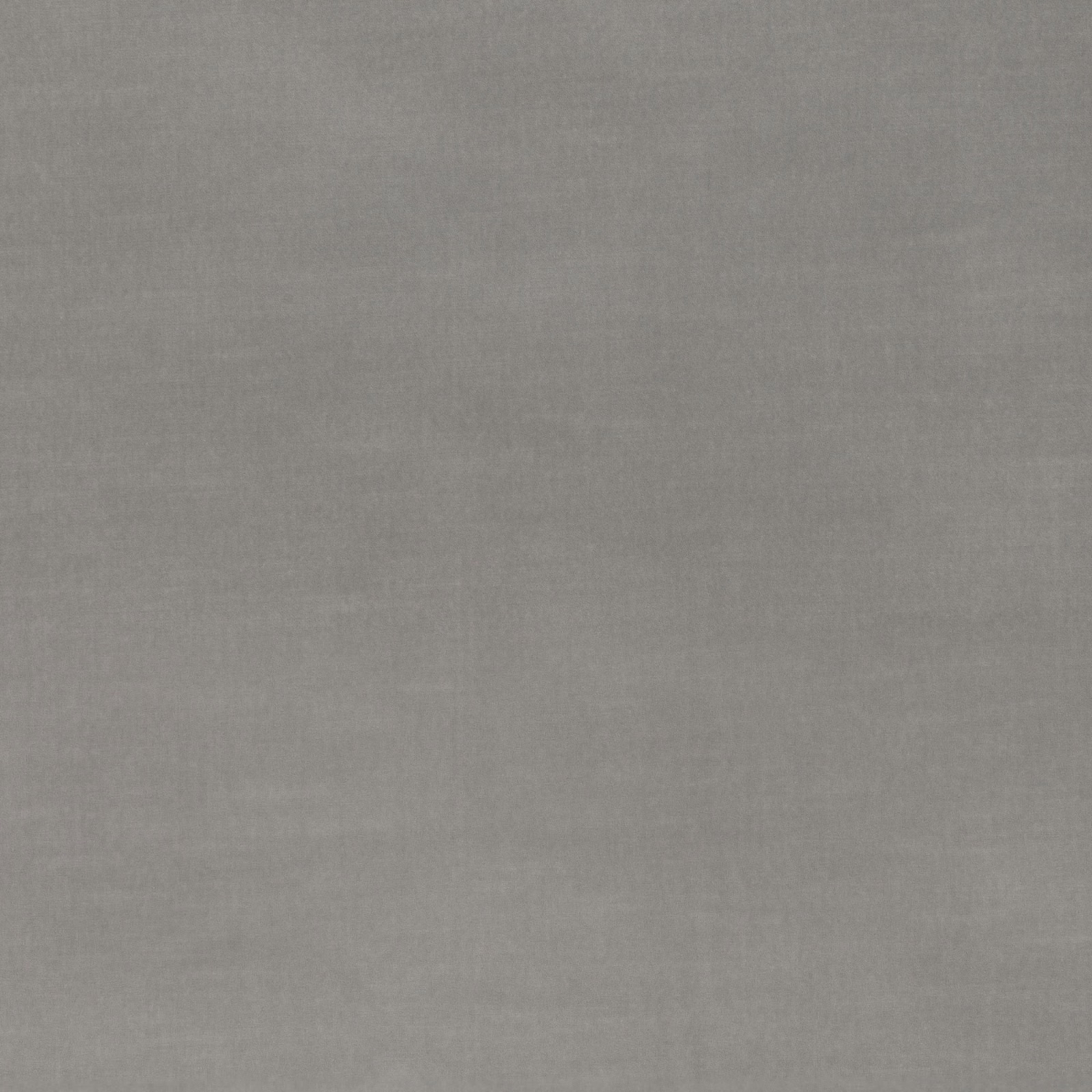 Close-up of smooth mid-grey velvet with a softly brushed, low-sheen surface