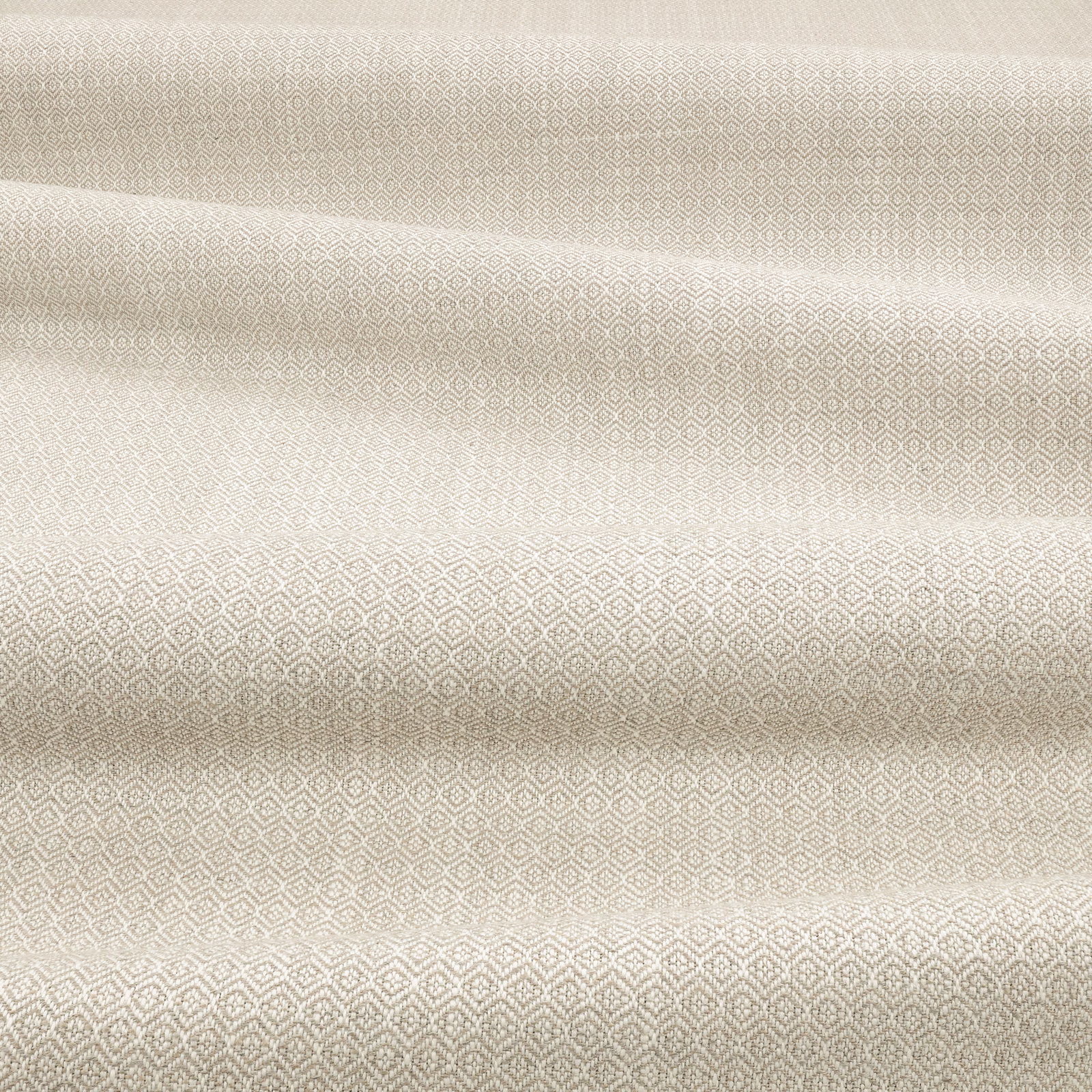 Folded M671 Sepia fabric with a warm taupe diamond lattice and woven texture