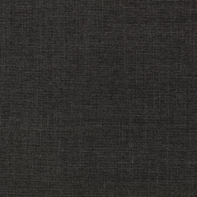 Close-up of charcoal-black M672 Midnight fabric with a fine crosshatched woven texture