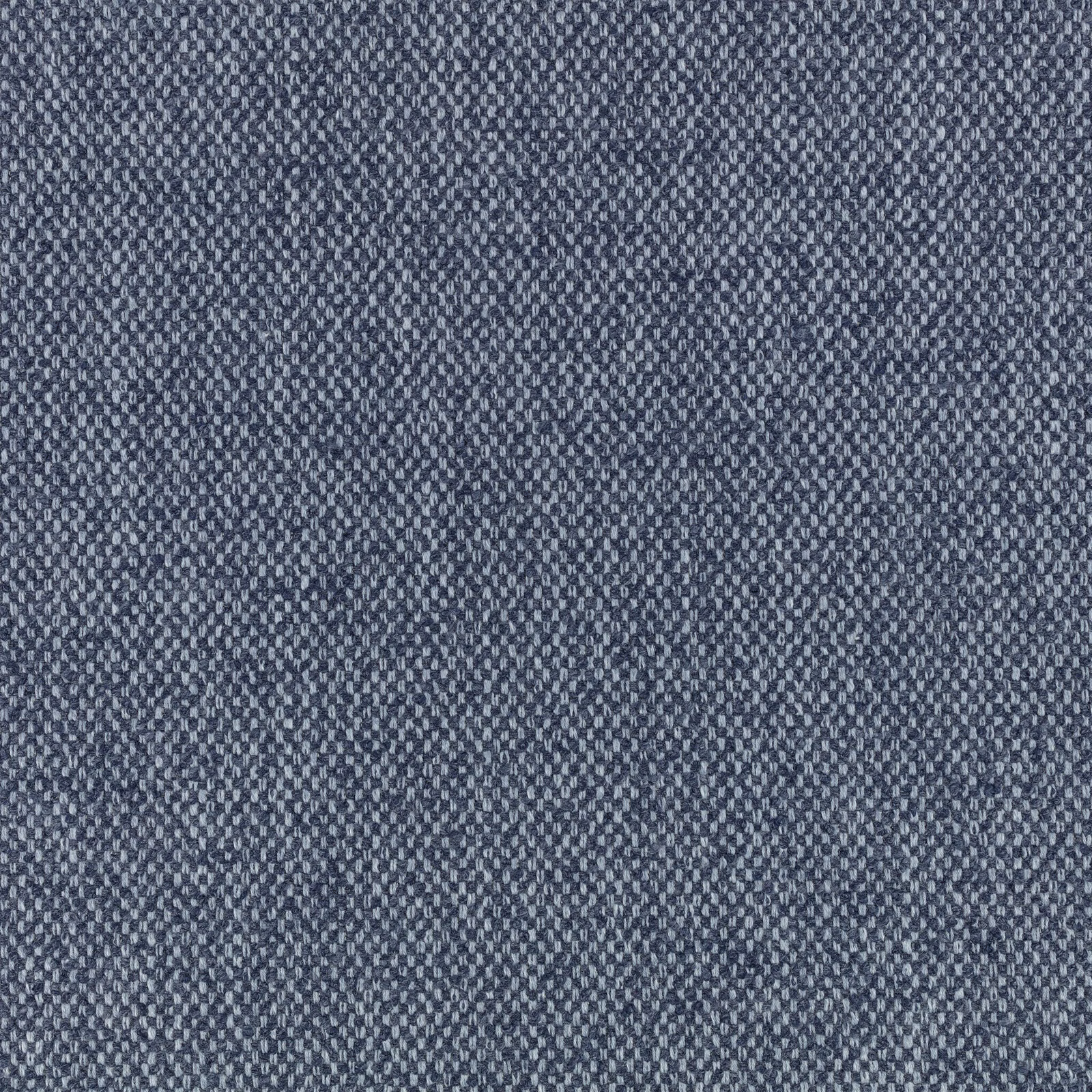 Close-up of cool indigo fabric with a fine slate-blue flecked weave