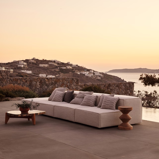 Warm sand-beige upholstery with a subtle woven texture on a modular sofa