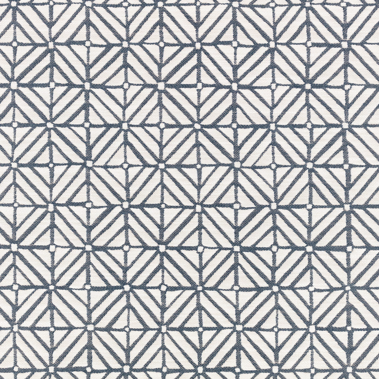 Indigo-blue angular lattice on a softly textured cream ground