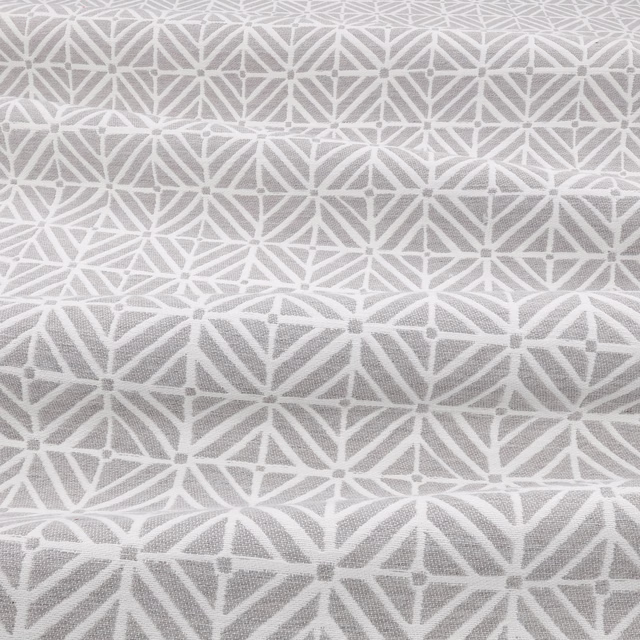 Silverbirch fabric in soft silver grey with a white geometric star lattice