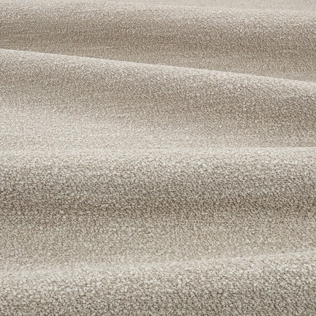 Warm sand beige nubby textile with subtle taupe flecks across folded swatch