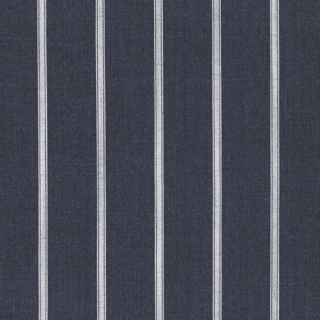 Close-up of deep indigo ticking fabric with narrow ivory vertical stripes and woven texture