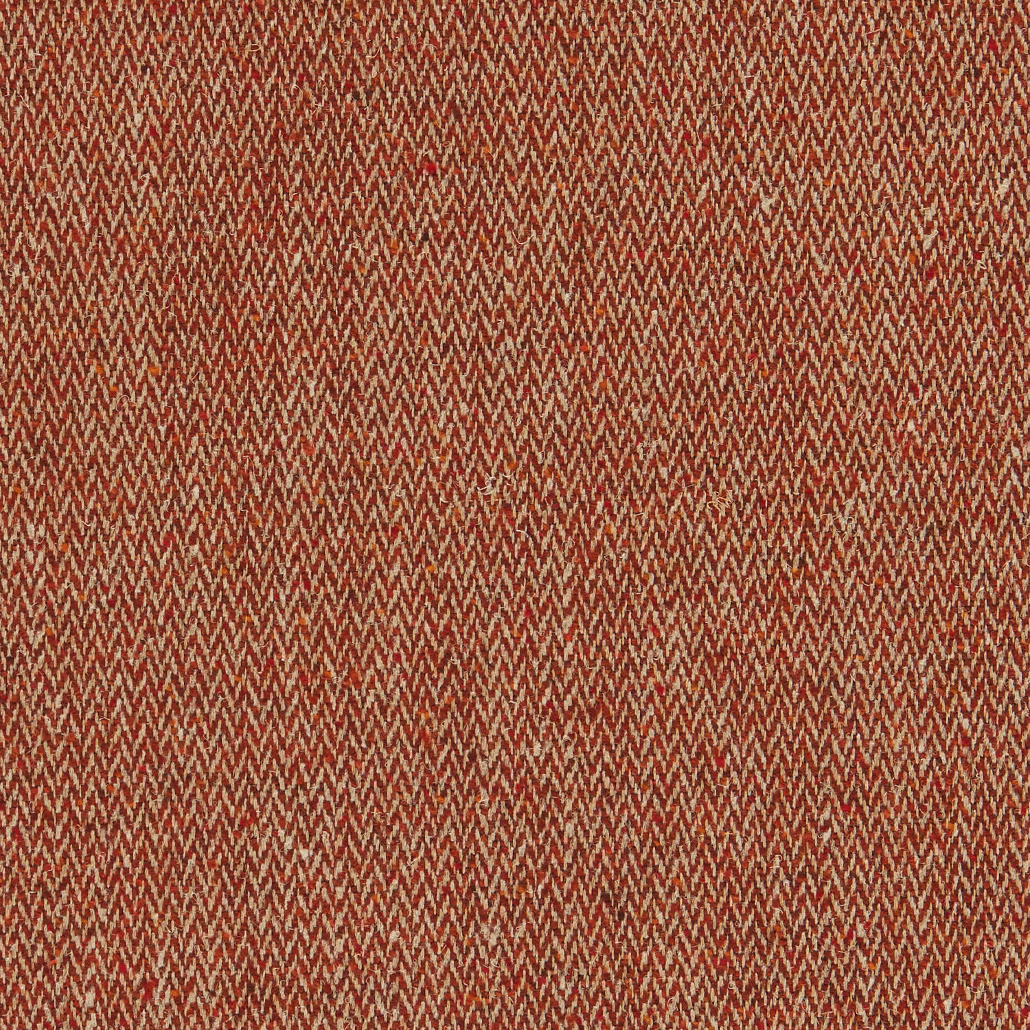 Close view of warm russet-red woven herringbone with fine cream-brown flecks