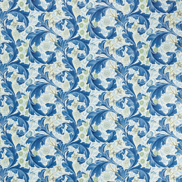 Cool blue scrolling leaves with pale blossoms and olive-green botanical accents on woven fabric