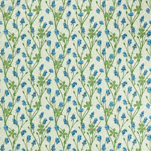 Cobalt blue flowers and green stems repeating across a pale cream woven fabric