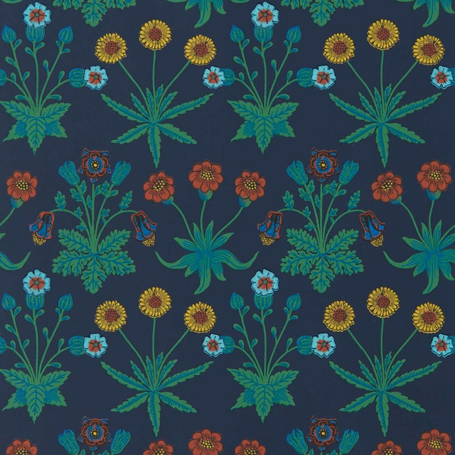Deep midnight-blue wallpaper with teal foliage, ochre daisies and coral flowers