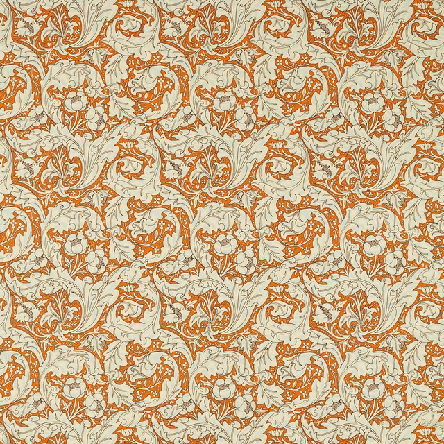 Burnt-orange and sky-blue scrolling floral fabric on a softly cream ground