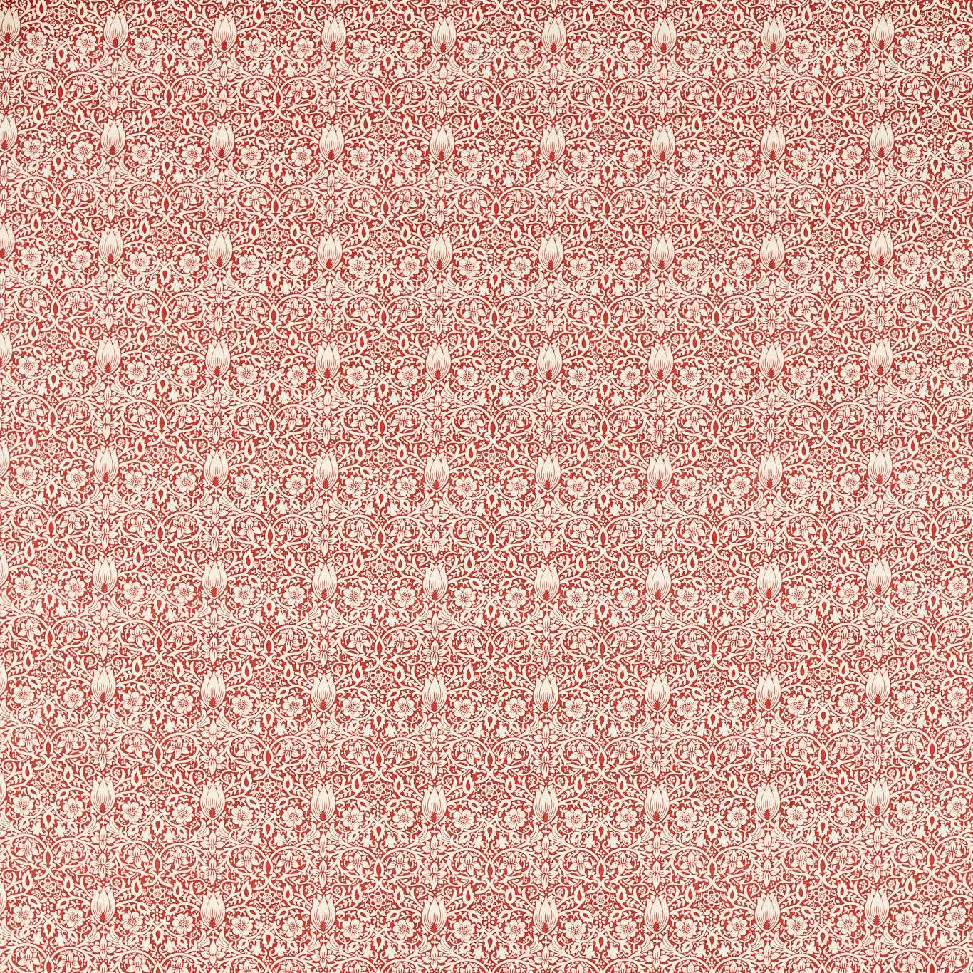 Muted berry-red fabric with dense cream scrolling florals and pale bud motifs