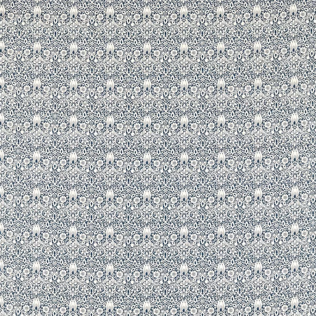 Cool blue-grey Borage Indigo textile with dense indigo botanical medallions and fine texture