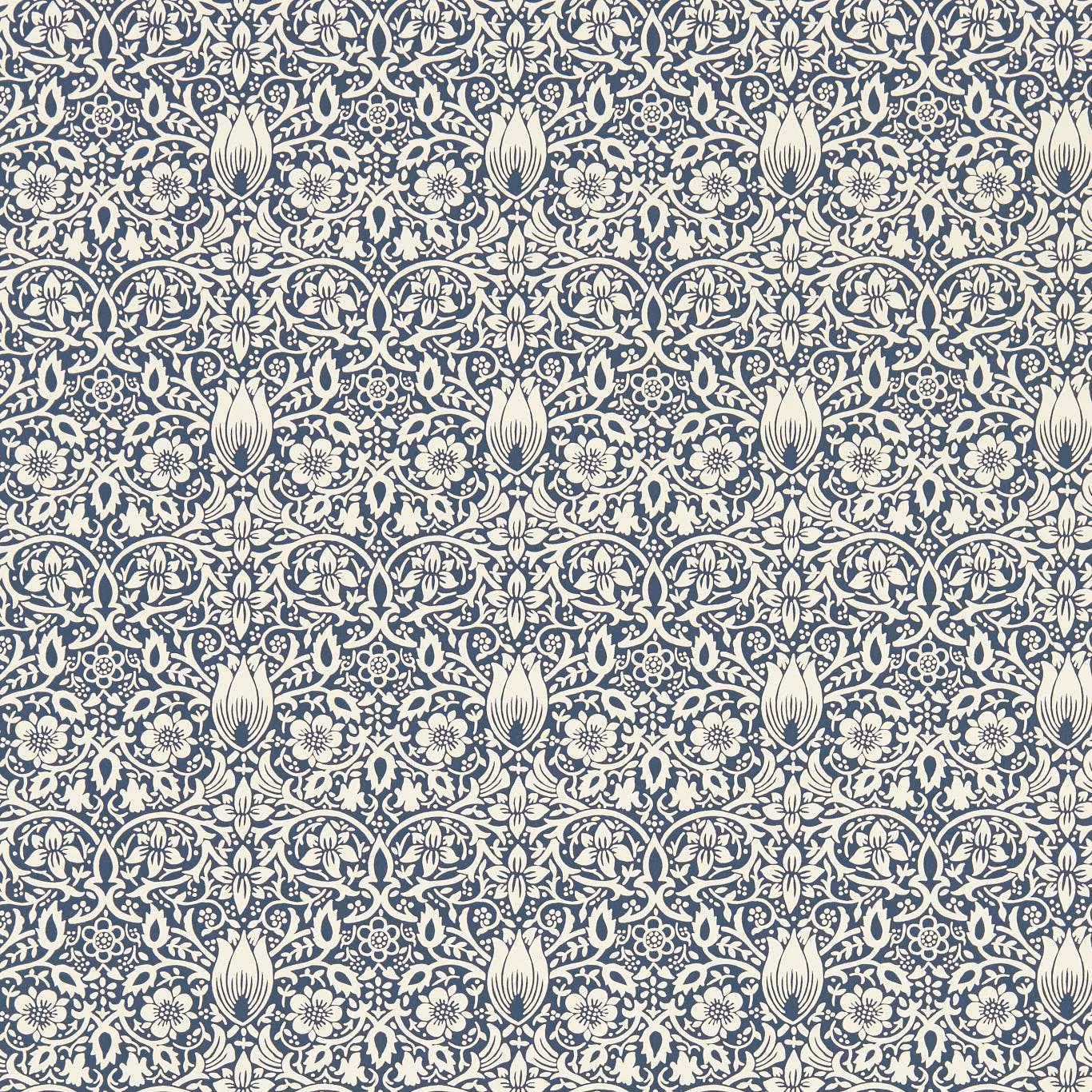 Dense cream floral and tulip motifs in a deep inky blue wallpaper