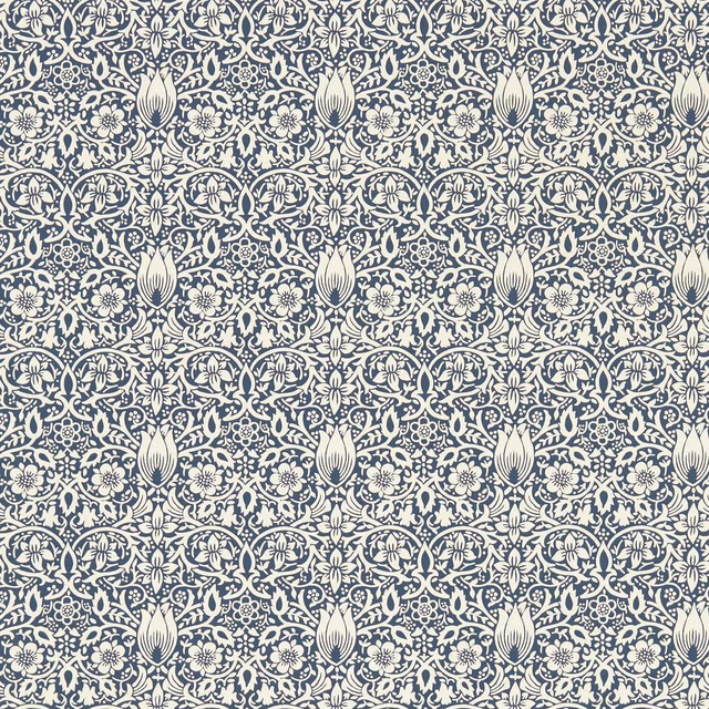 Dense cream floral and tulip motifs in a deep inky blue wallpaper