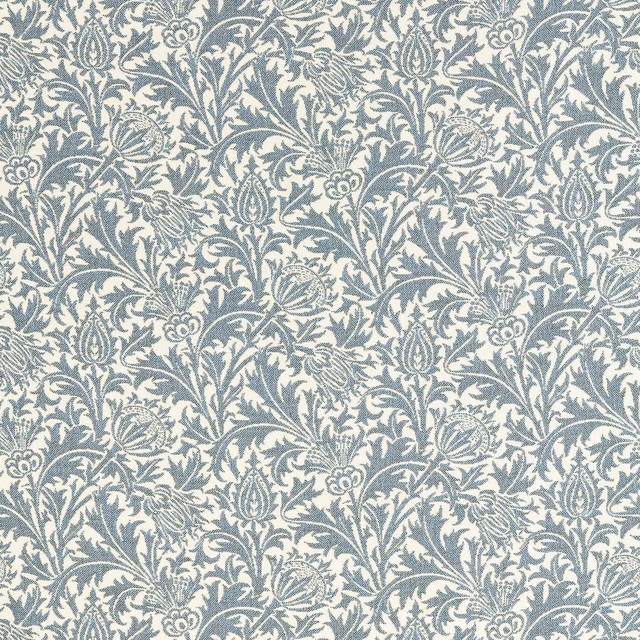 Ivory outdoor weave with dense blue-grey botanical foliage and stylised flowers