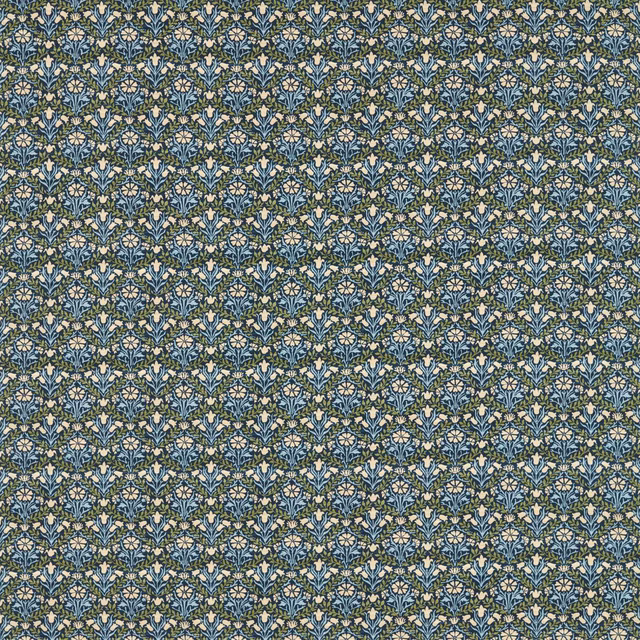 Dense indigo floral textile with thyme-green leaves and cream bellflower motifs