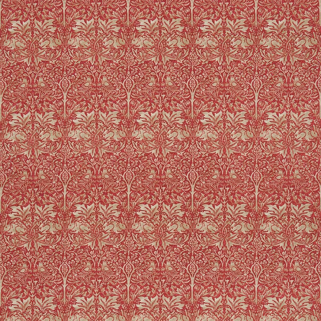Muted brick-red and hemp woven fabric with a dense symmetrical botanical repeat