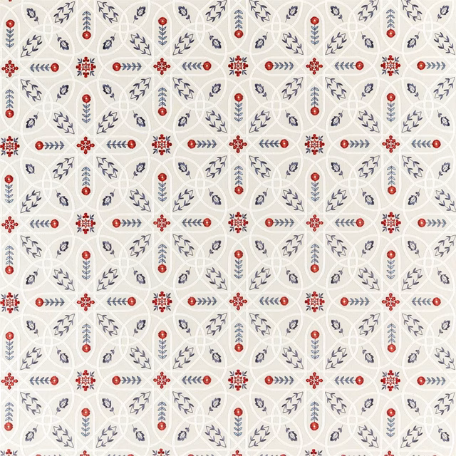 Cream textile with repeating indigo botanical marks and red geometric rosettes