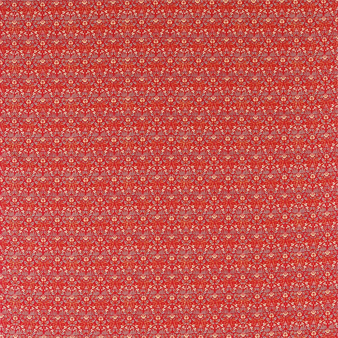 Dense ivory and blush floral motifs across a saturated crimson-red textile