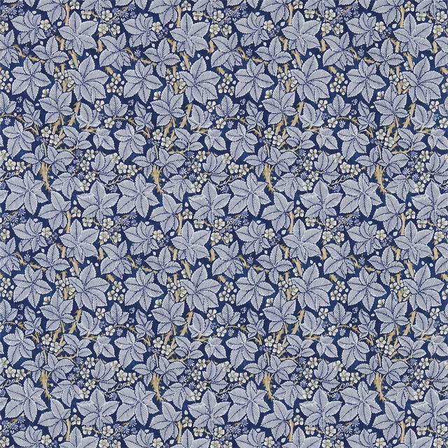 Indigo-blue floral leaves and berry sprigs on a mineral-grey woven ground