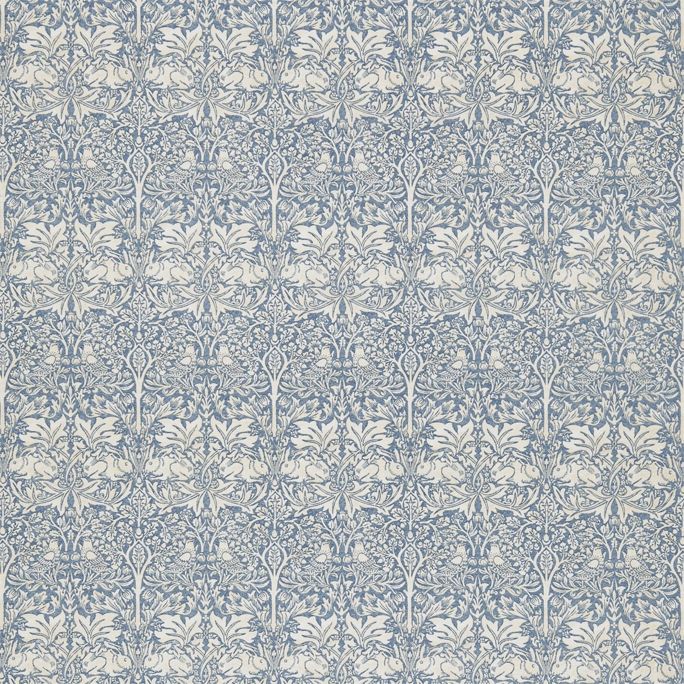 Slate blue and vellum fabric with dense repeating botanical stems and curling leaves