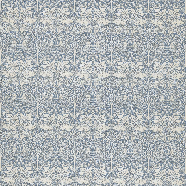 Slate blue and vellum fabric with dense repeating botanical stems and curling leaves