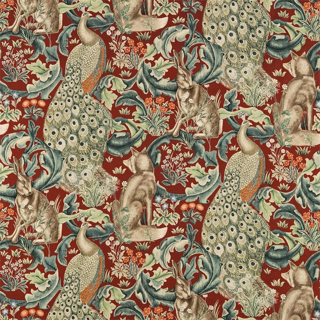 Deep red fabric with sage peacocks, rabbits, cream feather eyes and curling foliage