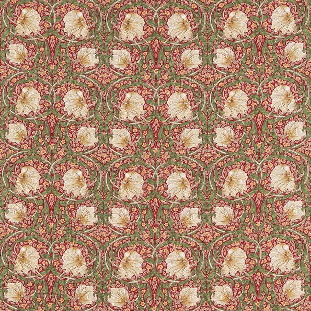 Red and thyme-green floral fabric with cream flowers and curling vines