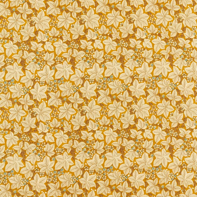 Dense cream floral sprigs over a warm ochre-gold textured ground