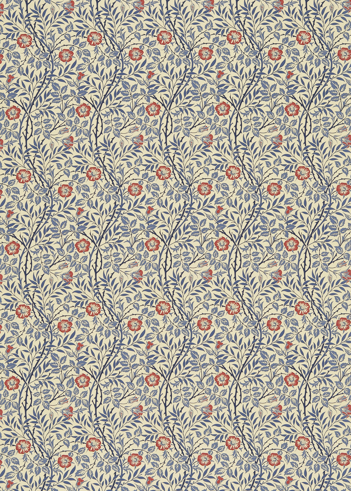 Indigo leafy stems and red flowers arranged across a warm cream floral fabric