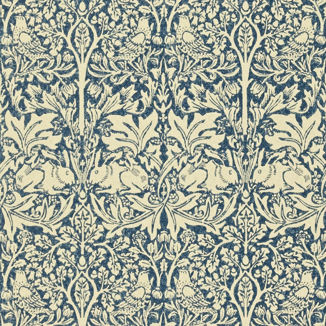Indigo rabbits, birds and scrolling foliage printed on a warm vellum wallpaper ground