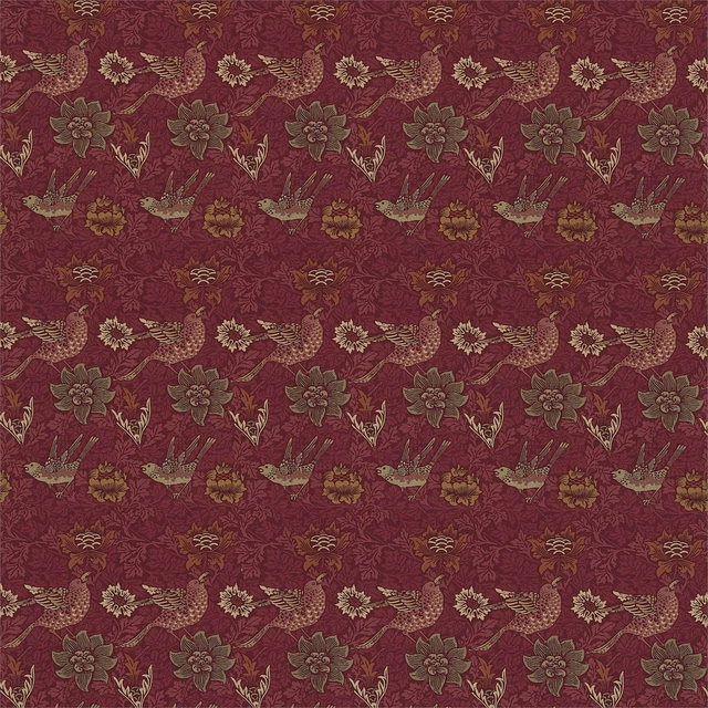 Red-clay ground with ochre birds, flowers and trailing foliage in a woven pattern